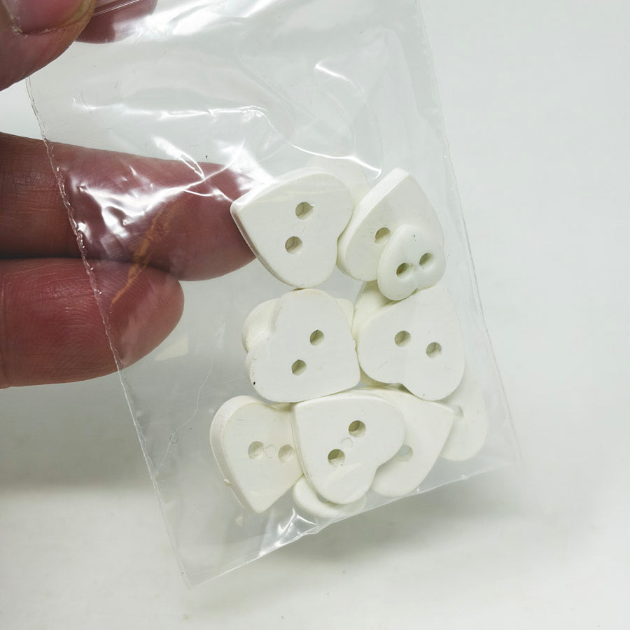 White Plastic Heart Buttons
