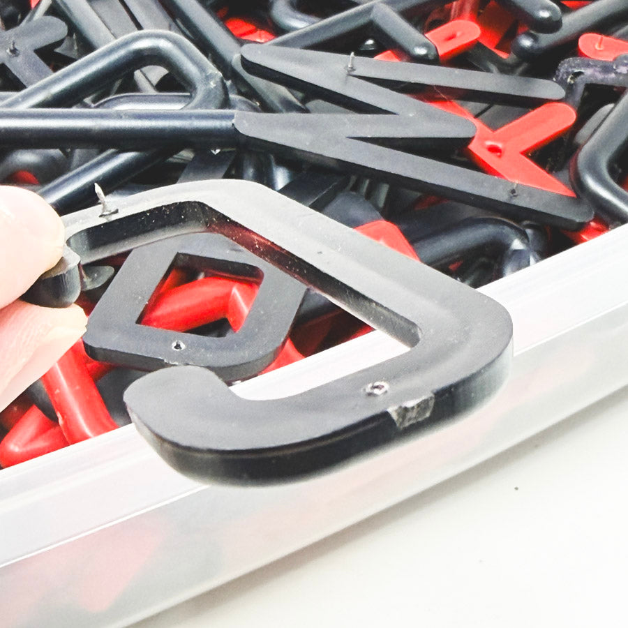 Box of Red and Black Felt Board Uppercase Letters