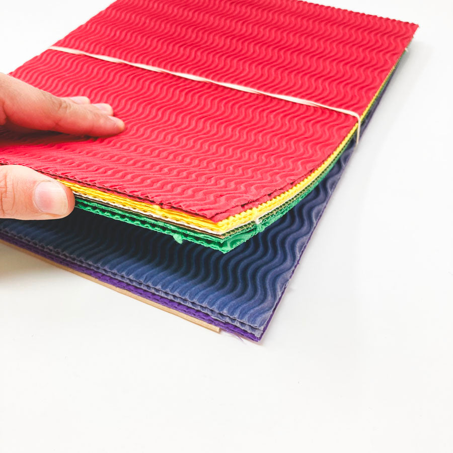 Stack of Wavy Corrugated Bright Paper