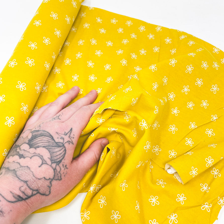 1 yd x 54" White Flowers on Yellow Jersey/Stretch T-Shirt Fabric