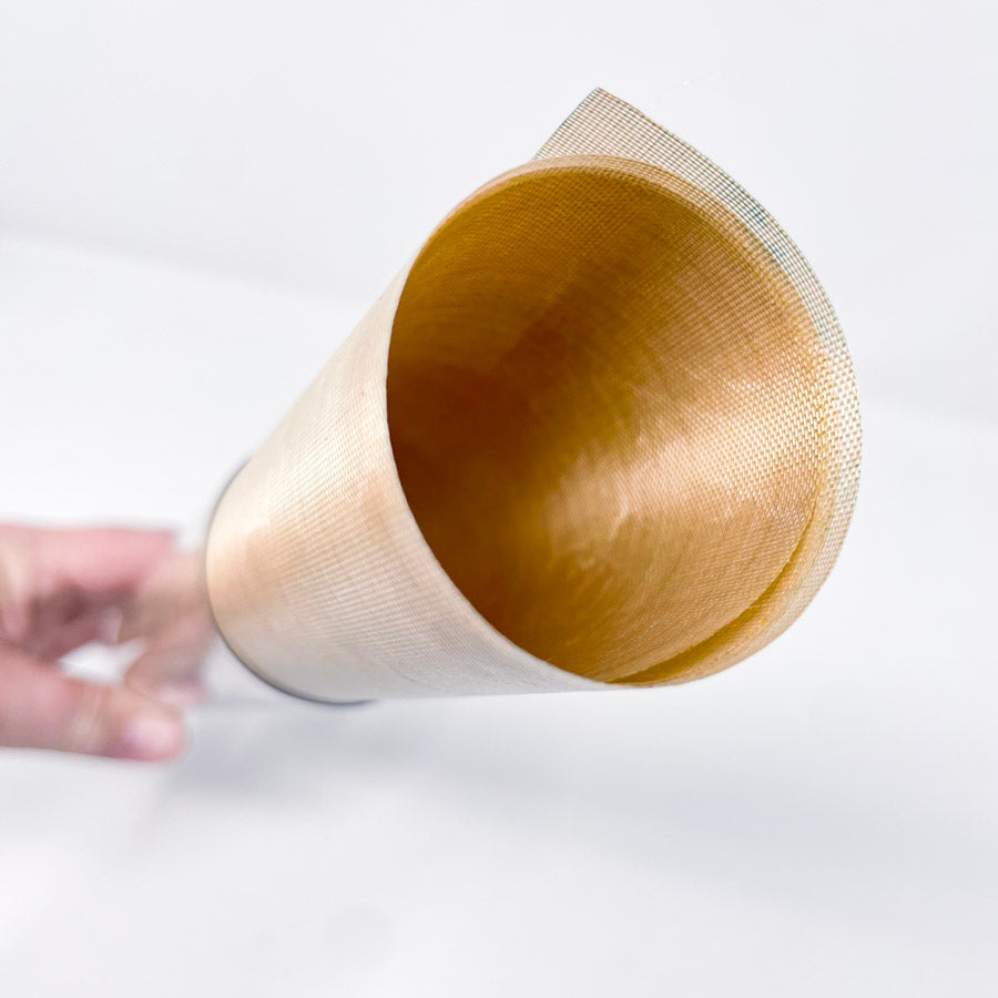 Brass colored mesh sheet in a roll
