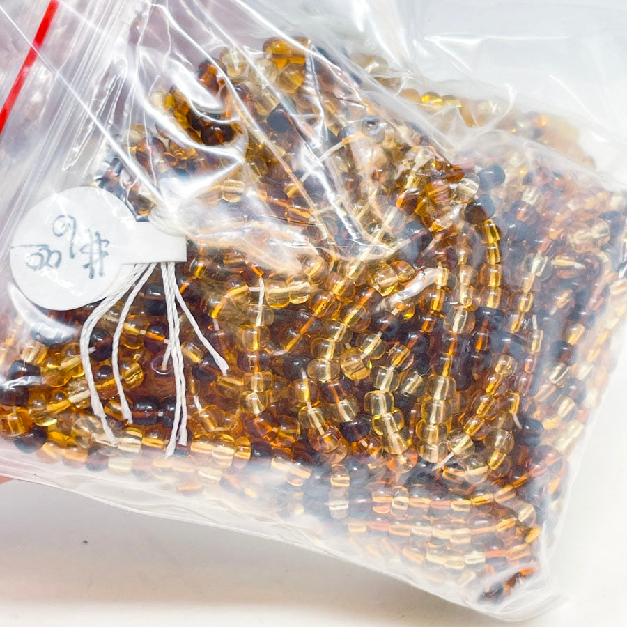 Strings of Amber Seed Beads