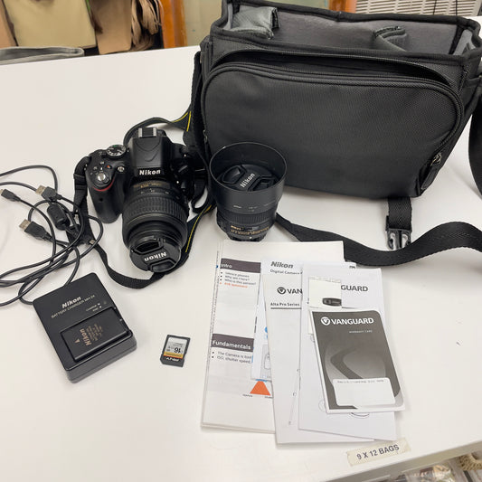 Nikon D5100 DSLR Camera Bundle – with 18-55mm VR Lens, 50mm f/1.8G Prime Lens, Bag, Charger & SD Card