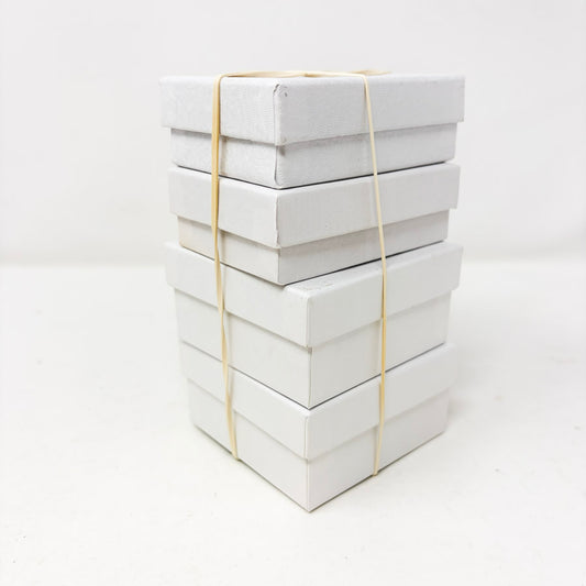 Stack of White Paper Jewelry Boxes with Cotton Inserts