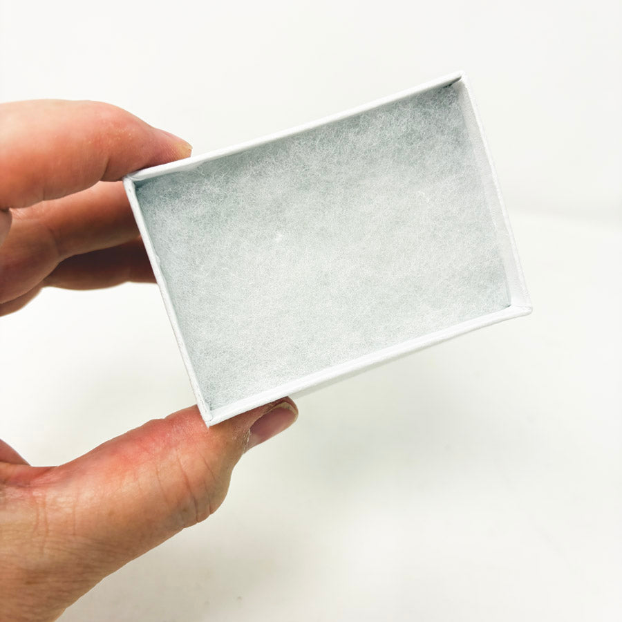 Stack of White Paper Jewelry Boxes with Cotton Inserts