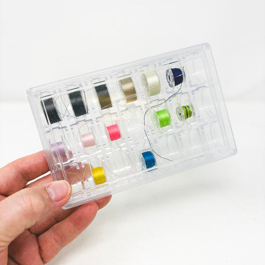 Plastic Bobbins in Case
