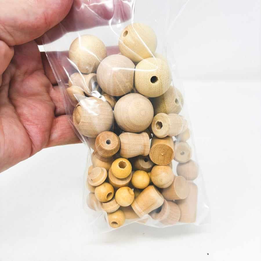 Bundle of Wood Caps, Beads, and Peg Dolls