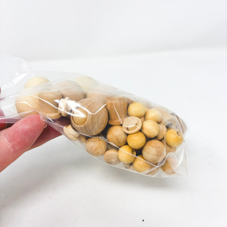 Bundle of Wood Caps, Beads, and Peg Dolls