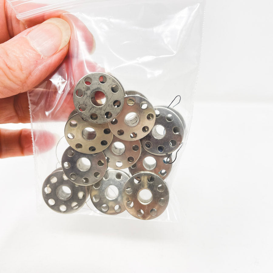Ten Metal Bobbins