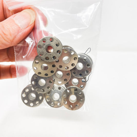 Ten Metal Bobbins