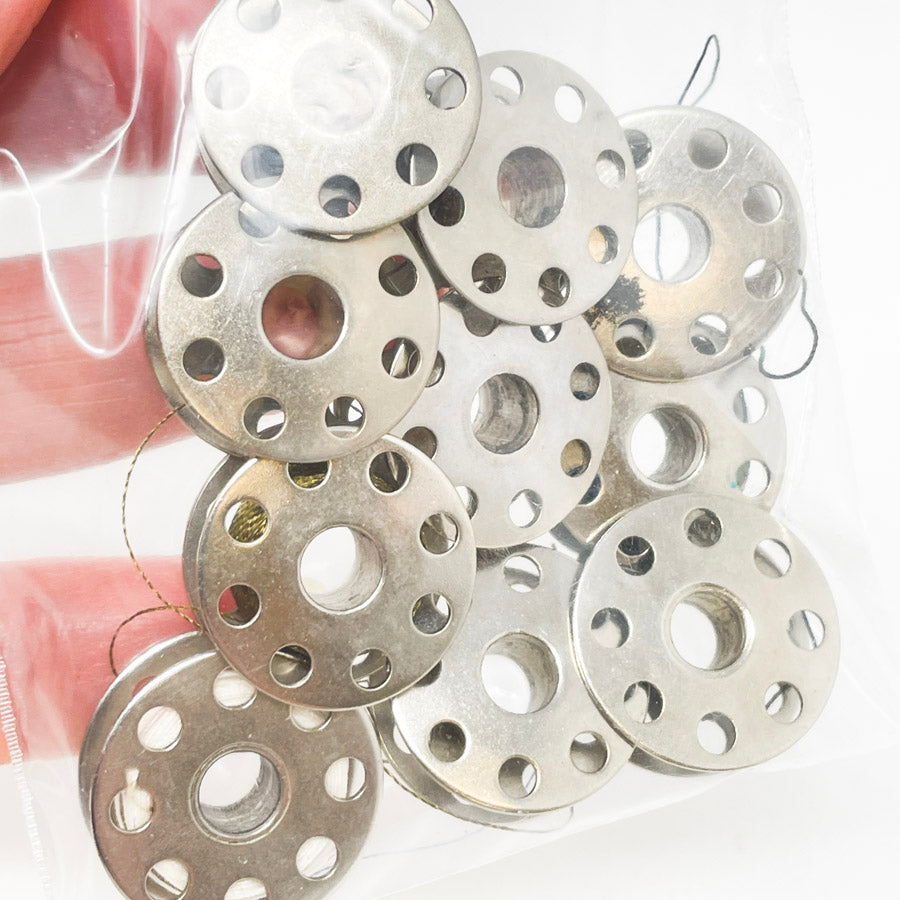Ten Metal Bobbins