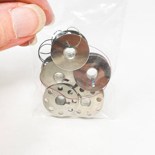 Five Metal Bobbins