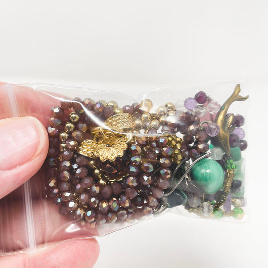 Purple, Green, and Gold Strung Beads and Jewelry