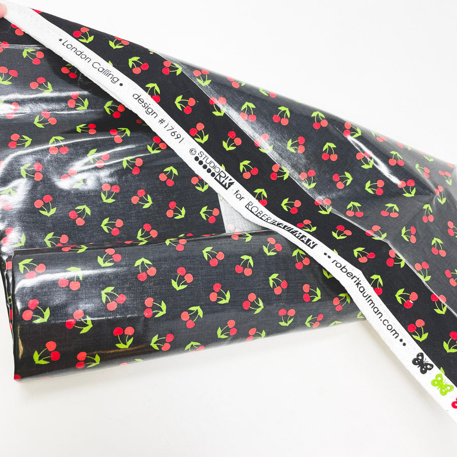 24" x 28" Cherries London Calling Design 17691 Laminated Fabric Remnant