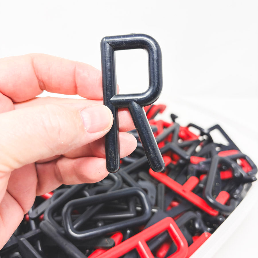 Box of Red and Black Felt Board Uppercase Letters