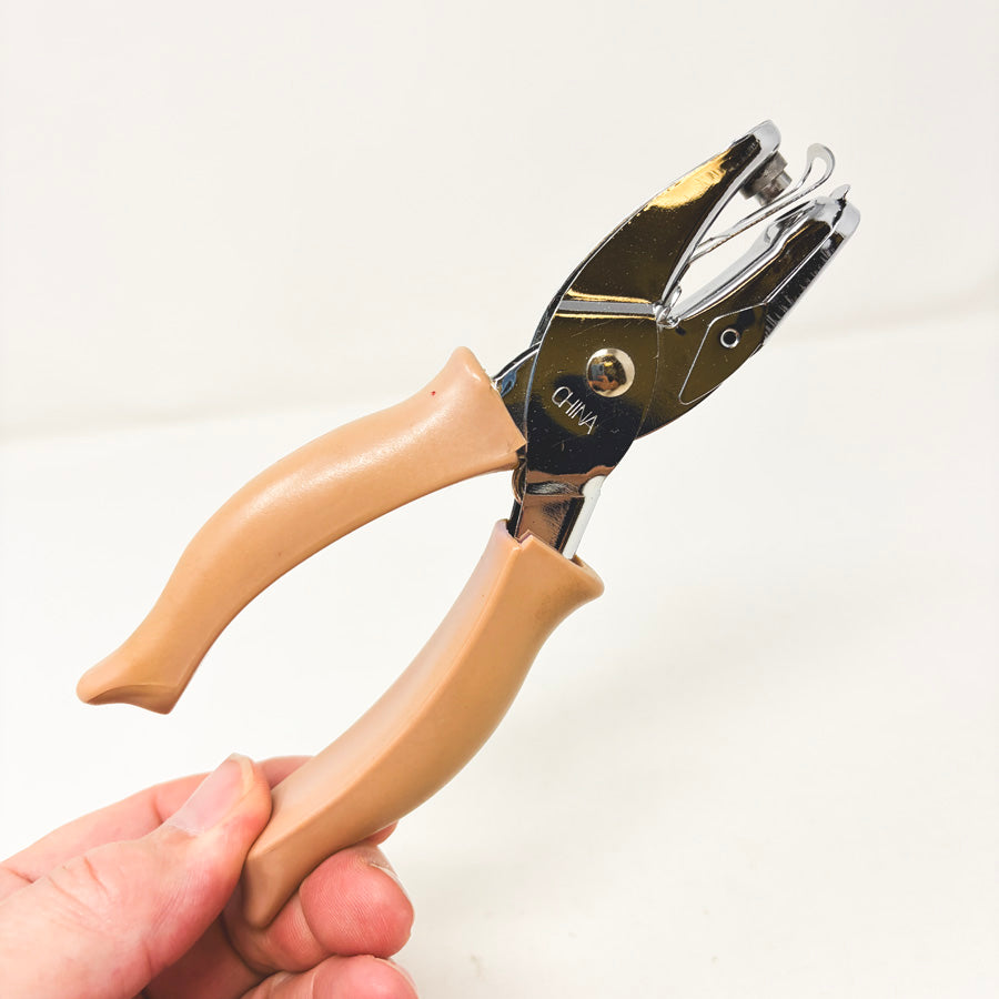 Tan Handle Hole Punch