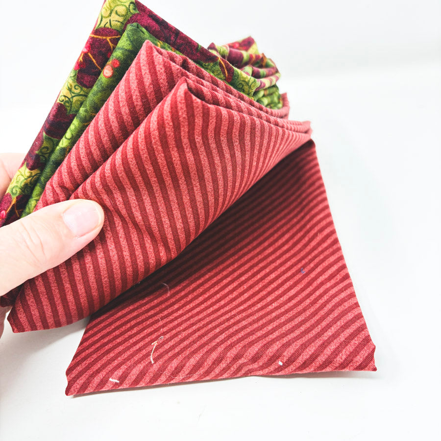 Stack of Festive Holiday Fabrics