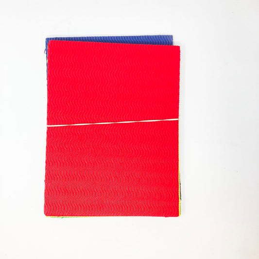 Stack of Wavy Corrugated Bright Paper