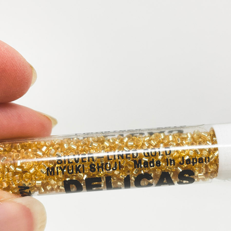 Delicas #11 Gold/Silver-lined Seed Beads (1)