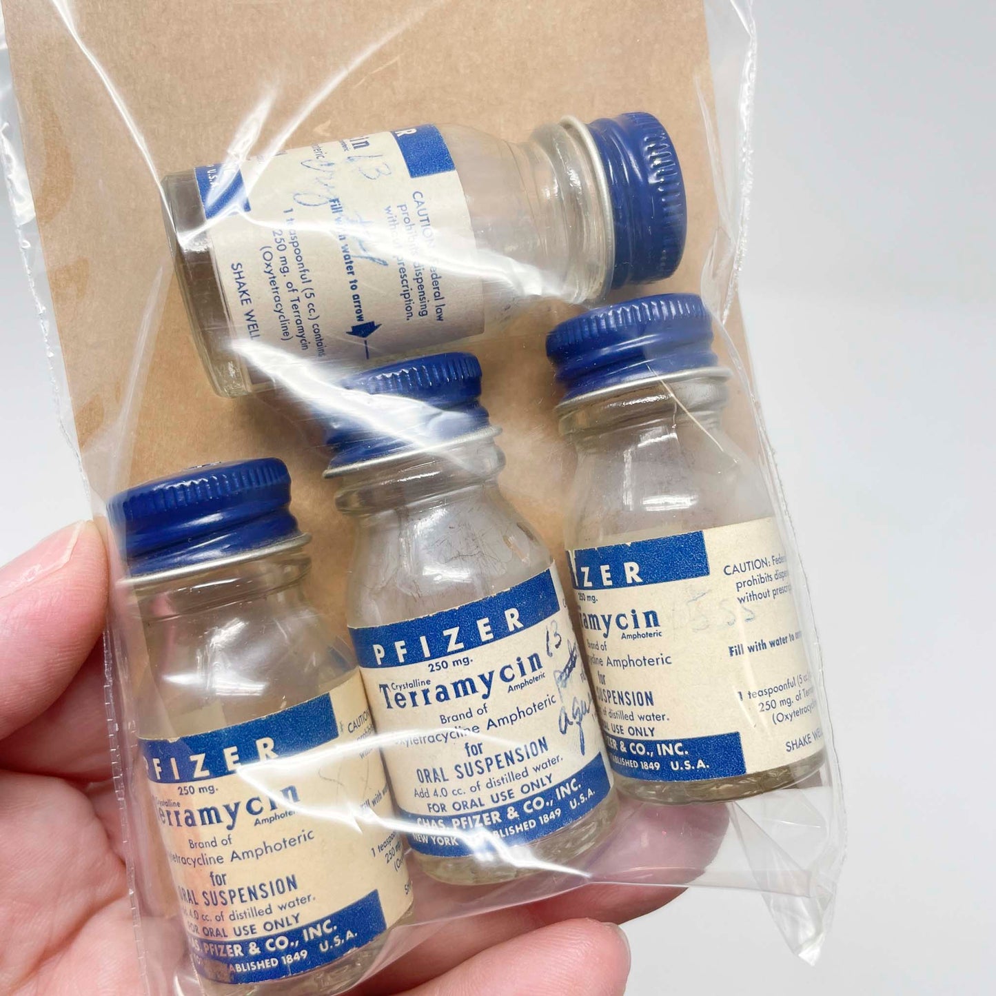 Four Mid-Century Terramycin Medicine Bottles